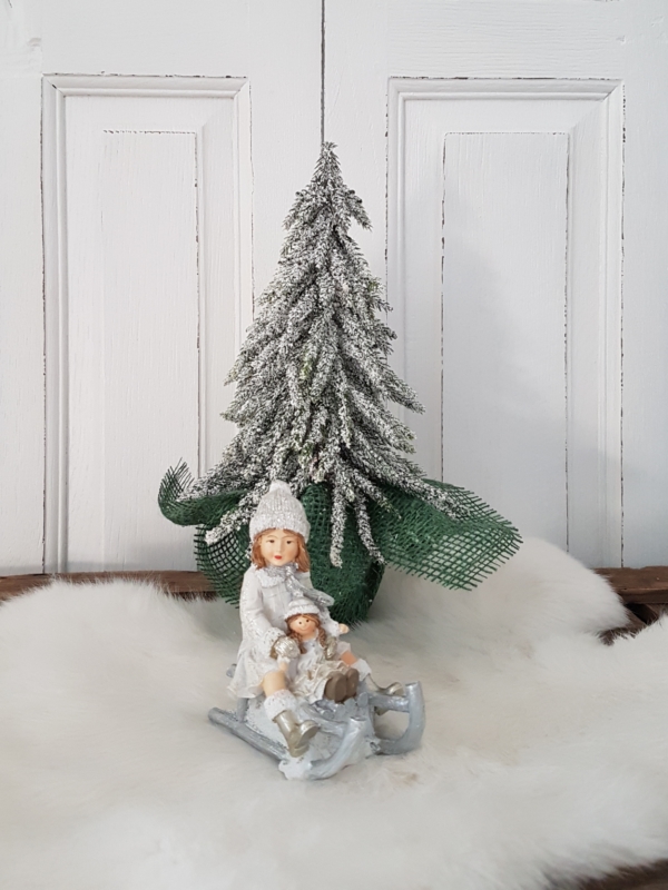 nostalgisches Winterkind auf Schlitten - weiß / grau / silber - Höhe 10 cm